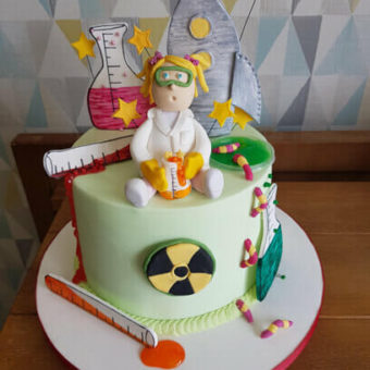 Science themed pale green birthday cake