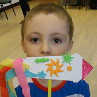 Boy with rocket craft made at Saturday activity session