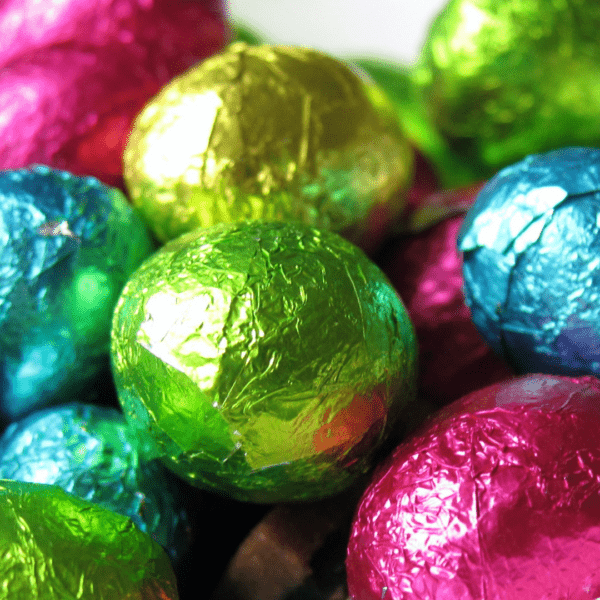 Bright pink, blue, gold and green foil covered small easter eggs