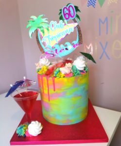 Tall buttercream multicoloured Club Tropicana themed 60th birthday cake