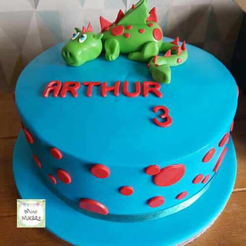 Blue 3rd birthday cake with red spots and green dragon decoration for Arthur