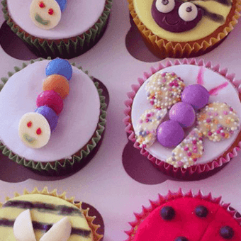 Close up of insect themed decorated cupcakes